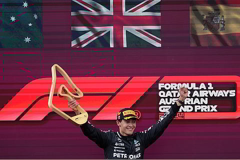 Mercedes driver George Russell with winners' trophy